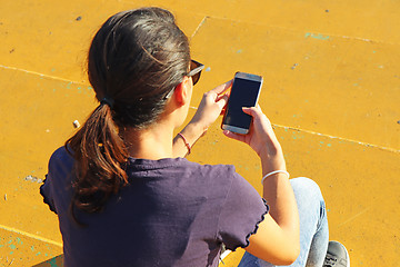 Image showing Young girl use smartphon