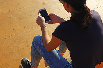 Image showing Young girl use smartphon