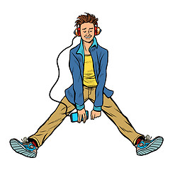 Image showing the young man sits and listens to music in headphones