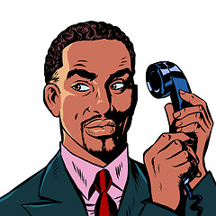 Image showing serious african man talking on a retro phone. isolate on white background