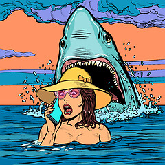 Image showing A shark attacks a woman at sea. The girl asks for help on the phone