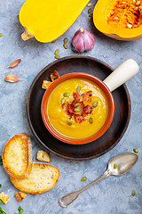Image showing Homemade pumpkin soup with crunchy bacon.