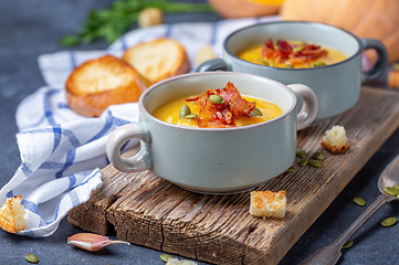 Image showing Pumpkin soup with bacon in a rustic style.