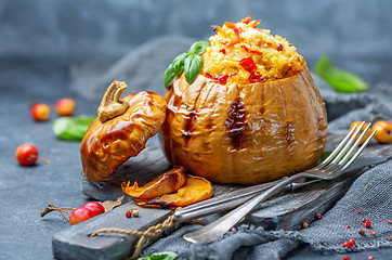 Image showing Ripe pumpkin baked with couscous and vegetables.