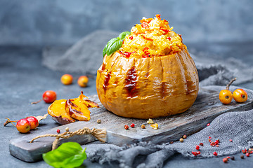 Image showing Baked pumpkin stuffed with couscous and vegetables.