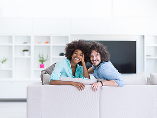 Image showing young multiethnic couple in living room