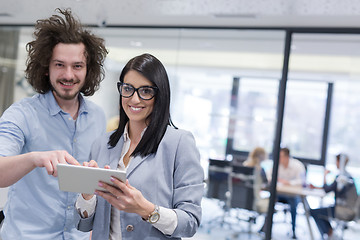 Image showing Business People Working With Tablet in startup office