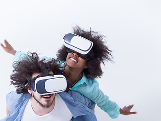 Image showing multiethnic couple getting experience using VR headset glasses