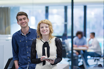 Image showing Business People Working With Tablet in startup office