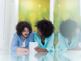 Image showing Couple relaxing together at home with tablet computer