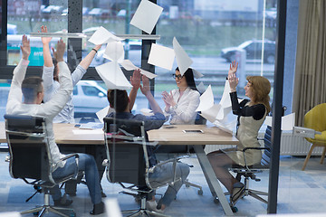 Image showing startup Group of young business people throwing documents