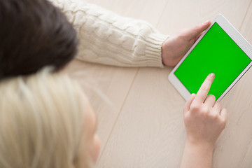 Image showing Young Couple using digital tablet on cold winter day