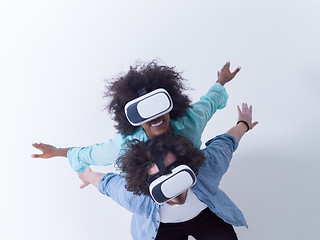 Image showing multiethnic couple getting experience using VR headset glasses