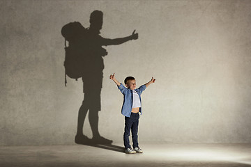 Image showing The little boy dreaming about tourism