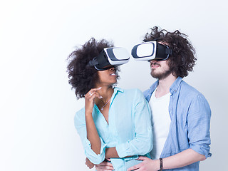 Image showing multiethnic couple getting experience using VR headset glasses