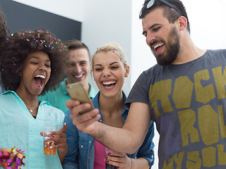 Image showing confetti party multiethnic group of people isolated over gray