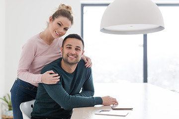 Image showing couple hugging in their new home