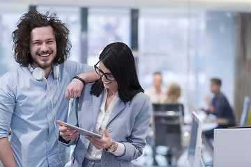 Image showing Business People Working With Tablet in startup office