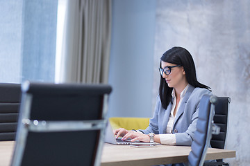 Image showing businesswoman using a laptop in startup office