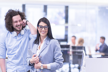 Image showing Business People Working With Tablet in startup office