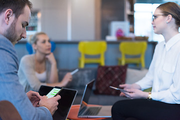 Image showing Young casual businessman using smartphone