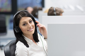 Image showing female call centre operator doing her job