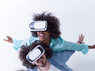 Image showing multiethnic couple getting experience using VR headset glasses