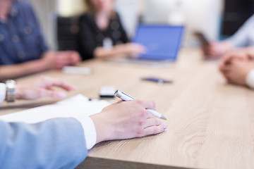 Image showing businesswoman hand using pen