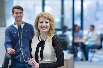 Image showing Business People Working With Tablet in startup office