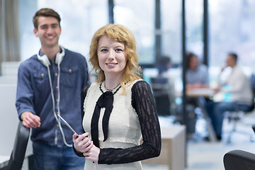 Image showing Business People Working With Tablet in startup office