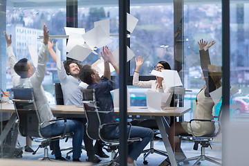 Image showing startup Group of young business people throwing documents