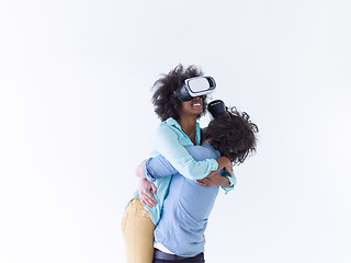 Image showing multiethnic couple getting experience using VR headset glasses