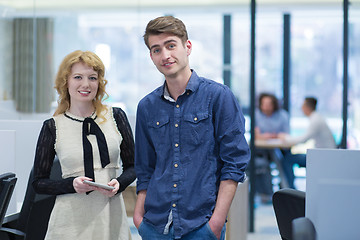 Image showing Business People Working With Tablet in startup office