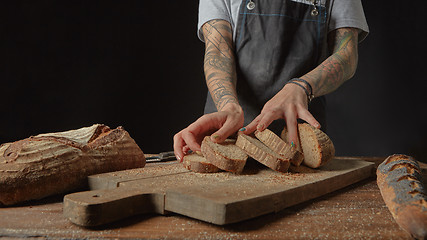 Image showing Baker Holds Bran Bread