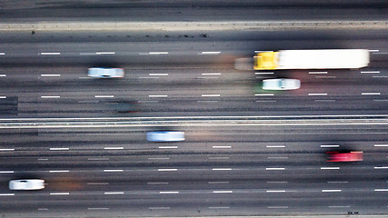 Image showing Aerial view road with passing cars blurred background. Photo from the drone