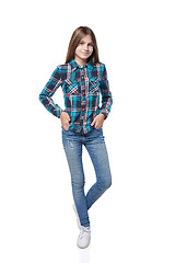 Image showing Teen girl in checkered shirt standing casually