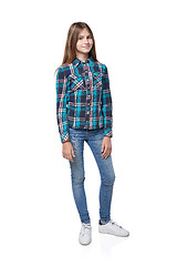 Image showing Teen girl in checkered shirt standing casually