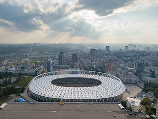 Image showing KYIV, UKRAINE - July 19, 2018. National Sports Complex Olympic, stadium NSC Olimpiysky. Panoramic viev from drone of cityscape and the stadium.