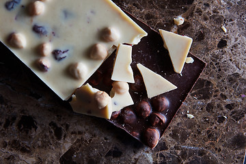 Image showing pieces of dark and white chocolate