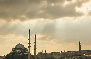 Image showing The view of Ortakoy Mosque and the houses on the Bosphorus shore with rays of the sun