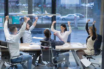 Image showing startup Group of young business people throwing documents