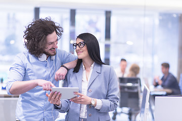 Image showing Business People Working With Tablet in startup office