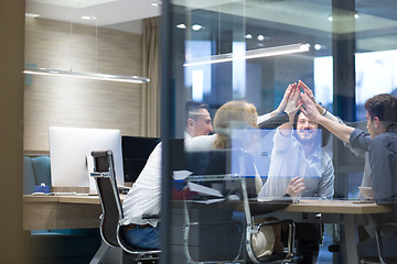 Image showing startup Group of young business people celebrating success