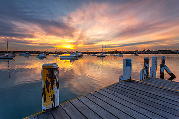 Image showing Yachts andl boats moored on tranquil waters 