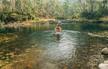 Image showing Woman wading in thermal springs in Australia