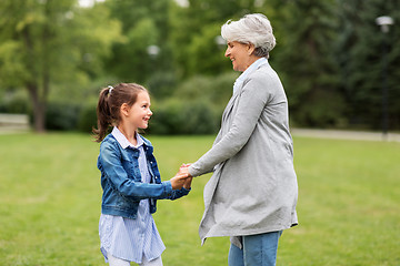 Image showing grandmother and granddaughter playing at park