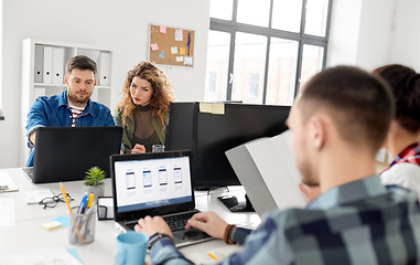 Image showing creative team working on user interface at office