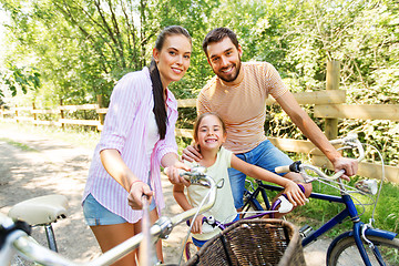 Image showing happy family with bicycles taking selfie in summer