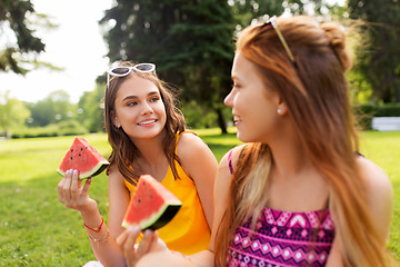 Image showing teenage girls eating watermelon at picnic in park