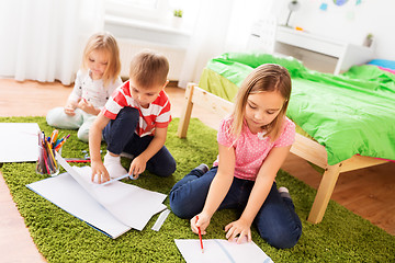 Image showing children drawing and making crafts at home